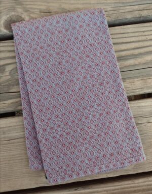 Handwoven cotton hand towel in rhododendron and heather blue.