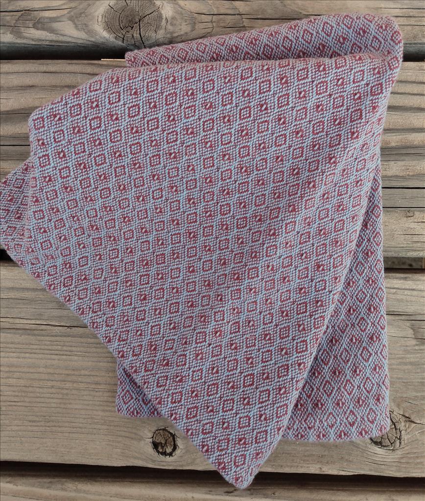 Handwoven cotton hand towel in rhododendron and heather blue.