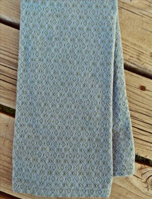 Handwoven cotton towel in sage and heather blue.