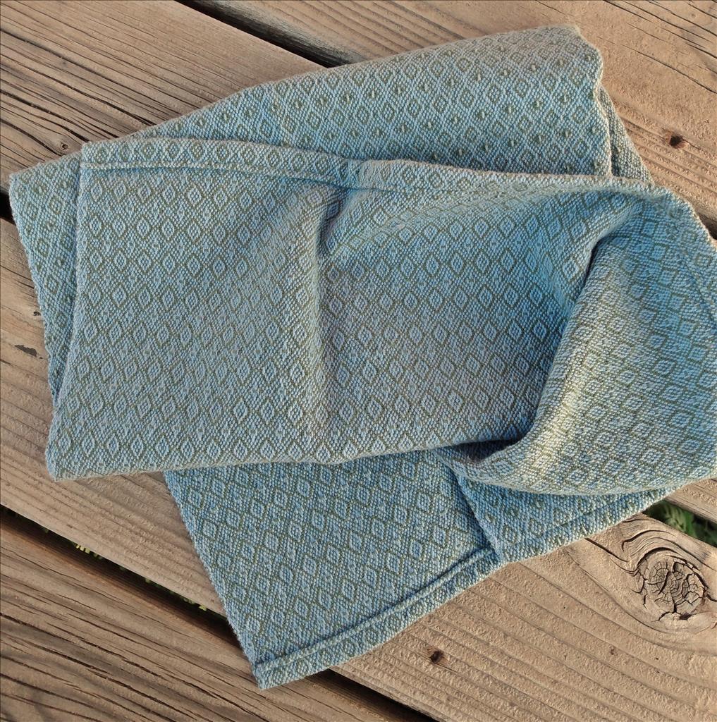 Handwoven cotton towel in sage and heather blue.