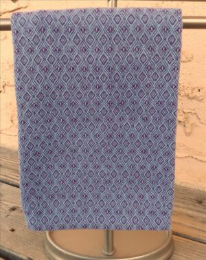 Handwoven cotton hand towel in amethyst and heather blue.